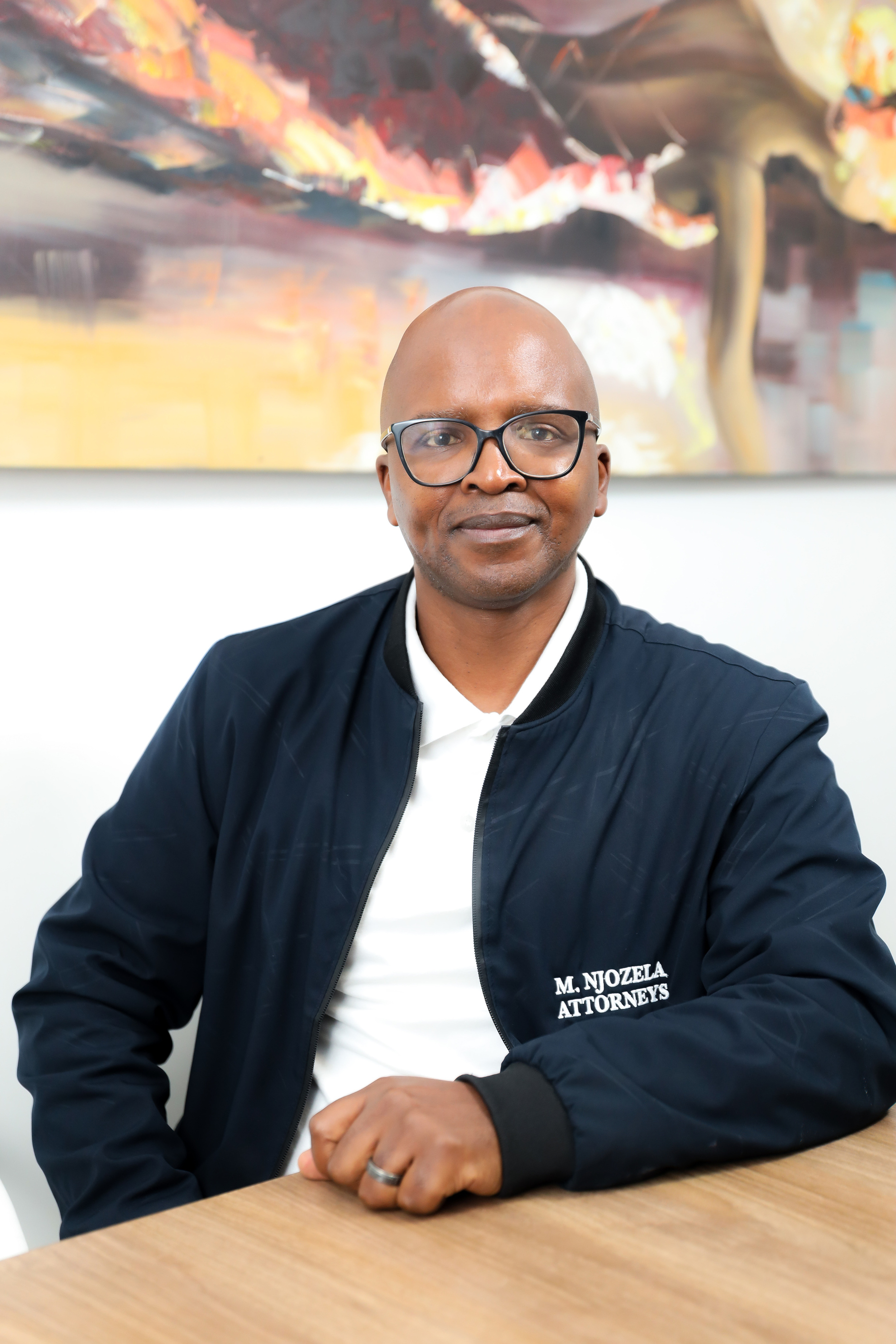 Mr Njozela, Director